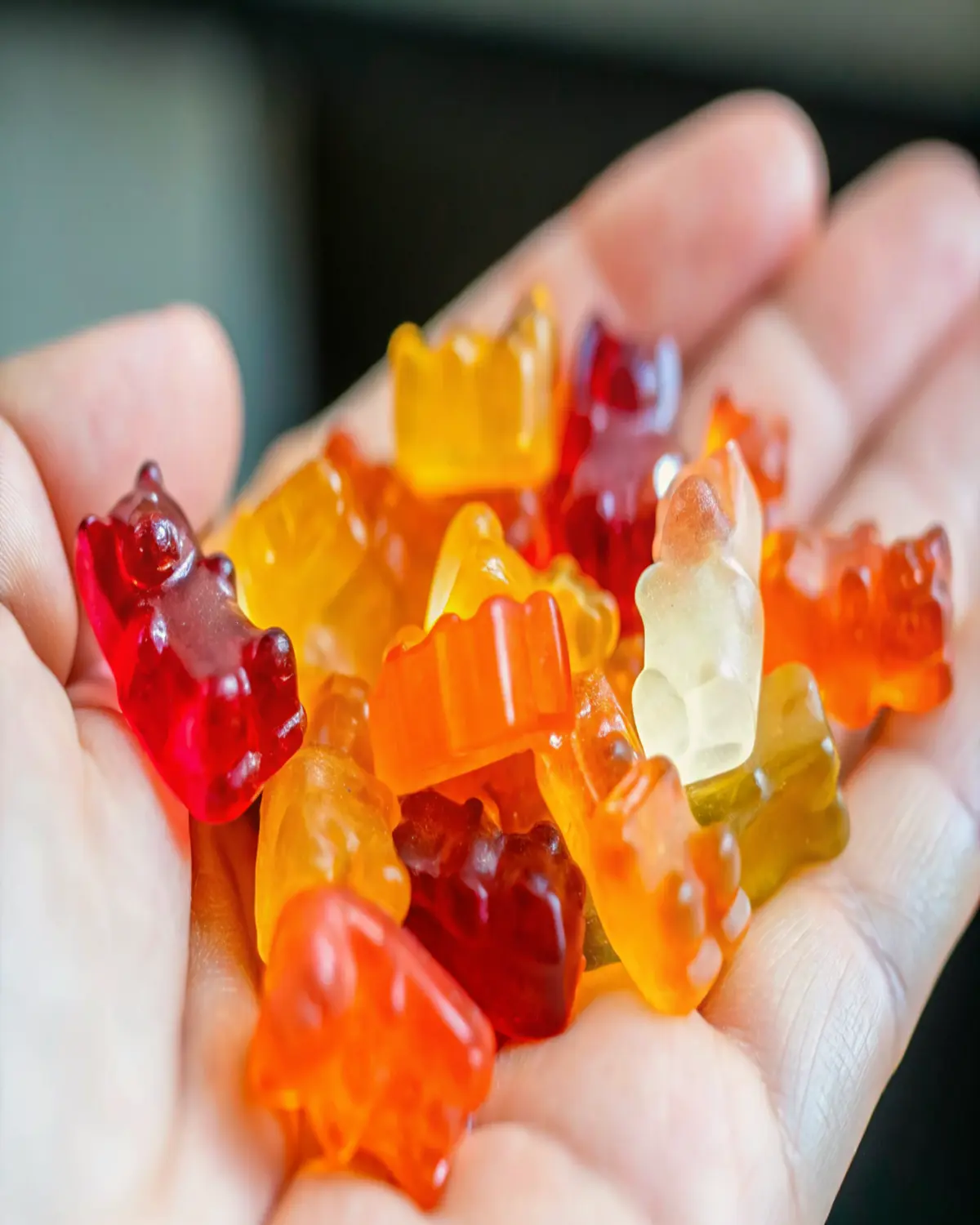 healthy-jelly-sweets-handful Handful of colorful homemade healthy jelly sweets shaped like gummy bears